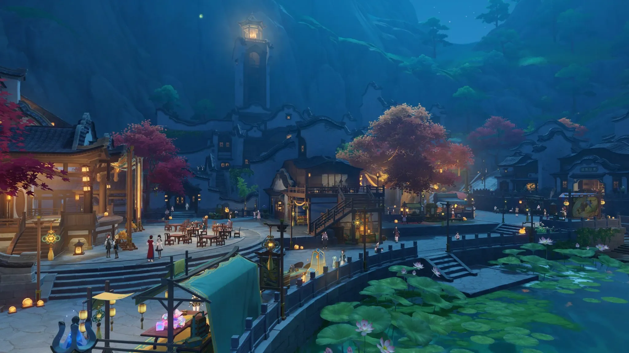 A serene night landscape of a traditional Asian village with glowing lanterns, a lotus pond, and lush trees. People are seen walking and mingling around the illuminated buildings.